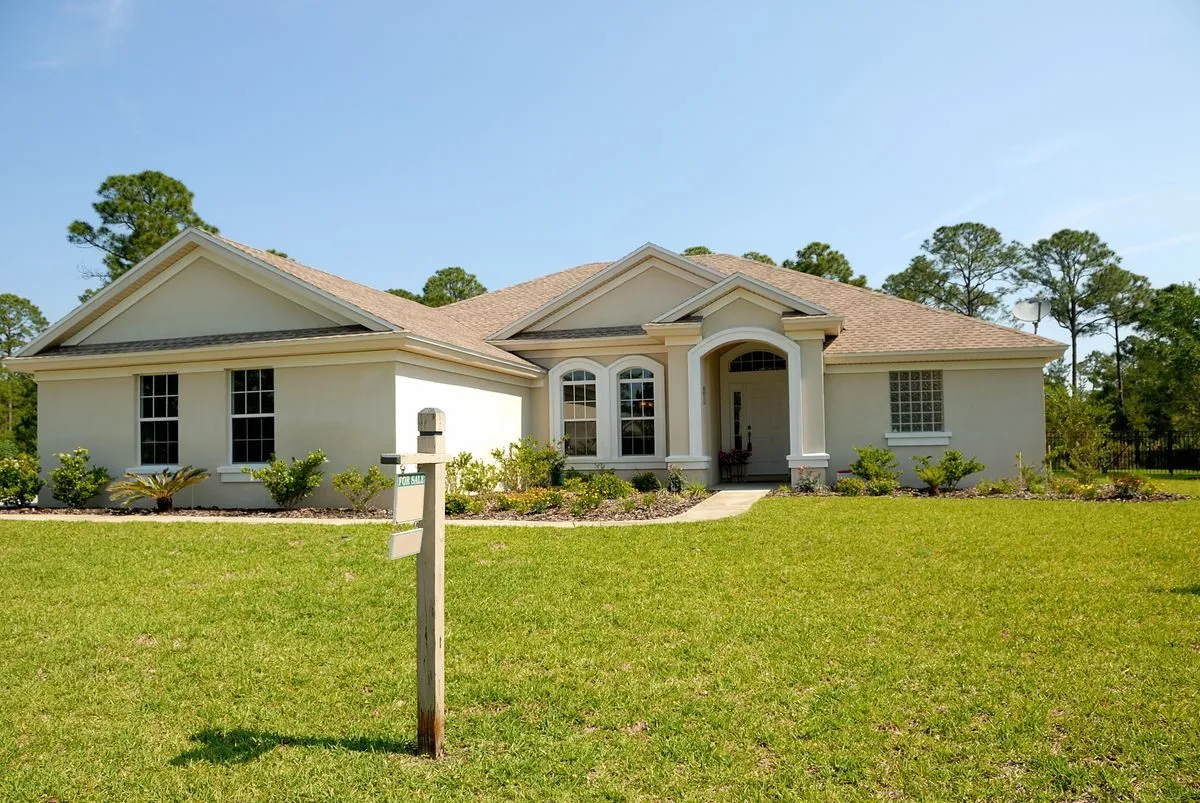 Home with concrete walkway leading to the front entry